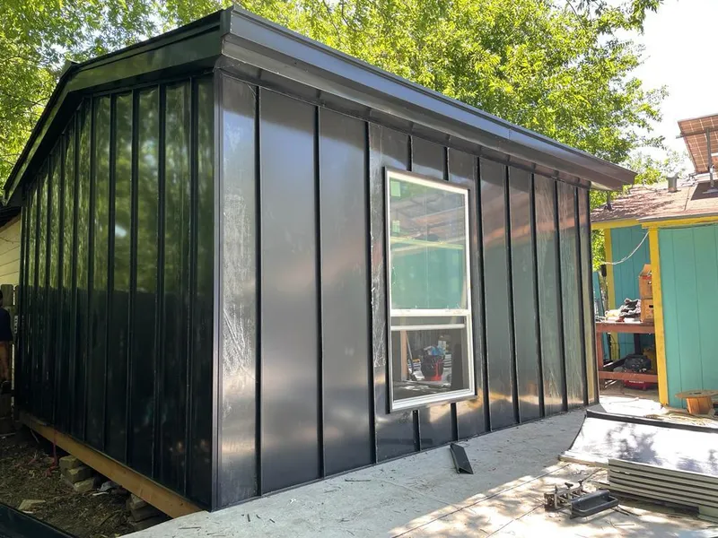 Black standing seam metal wall panels for Roof Inspection in Brecknock